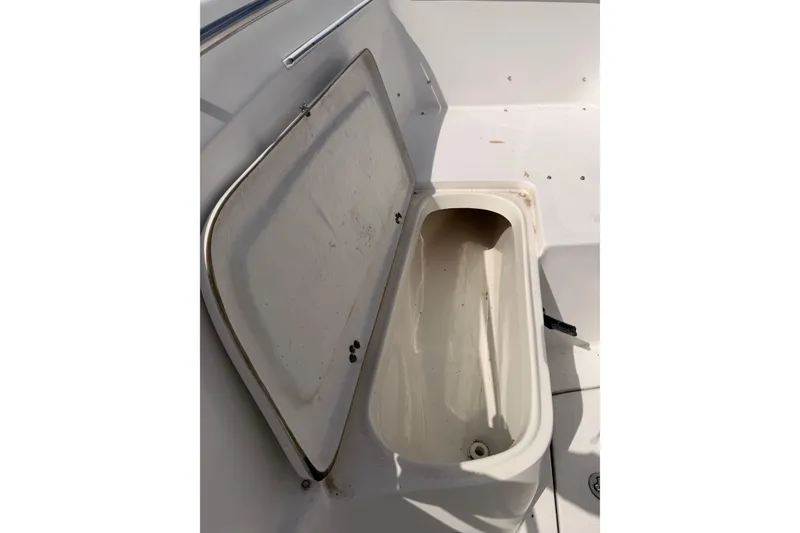 Slide: The Image of Open storage compartment on a 2005 Sailfish 236 CC boat. - 8