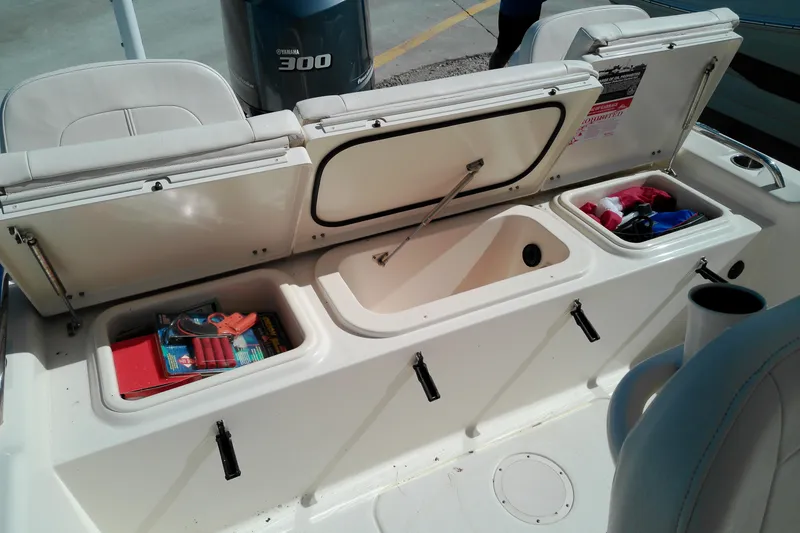 Slide: The Image of 2015 Grady-White 251 Coastal Explorer boat storage compartments with Yamaha 300 engine. - 15