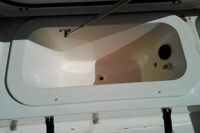 Slide: The Image of Livewell compartment on a 2015 Grady-White 251 Coastal Explorer boat. - 17