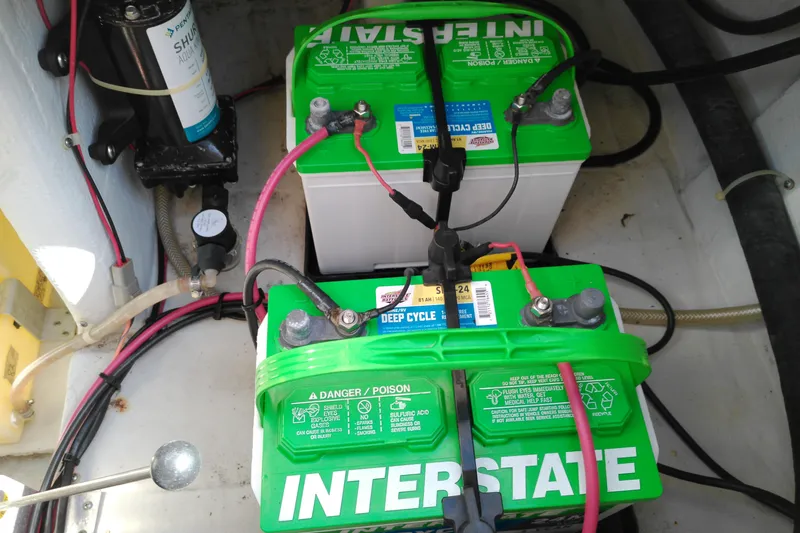 Slide: The Image of Two Interstate deep cycle batteries in a 2015 Grady-White 251 Coastal Explorer boat. - 18