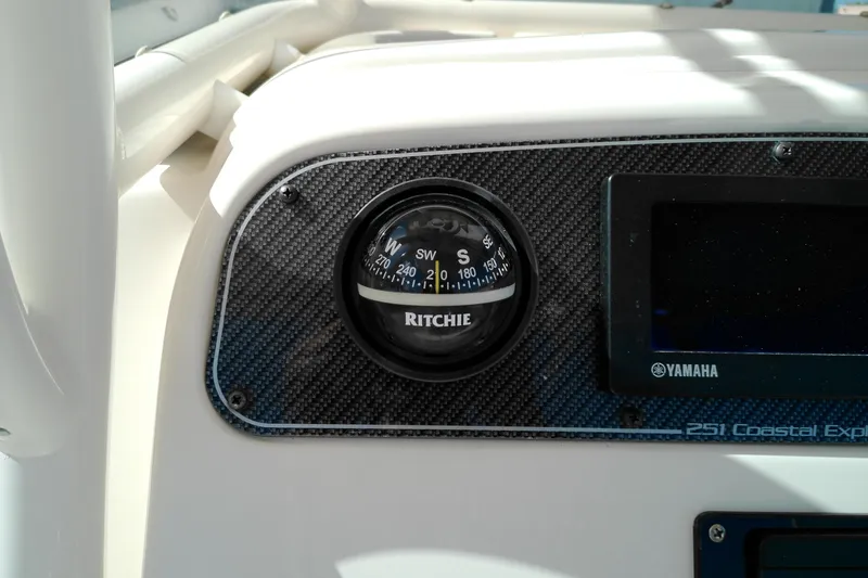 Slide: The Image of Compass and display on 2015 Grady-White 251 Coastal Explorer boat dashboard. - 22