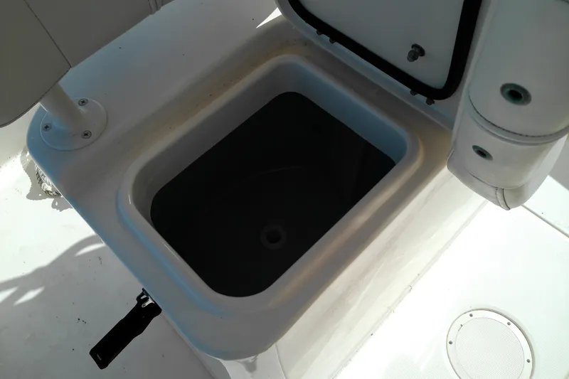 Slide: The Image of Open storage compartment on 2015 Grady-White 251 Coastal Explorer boat deck. - 25