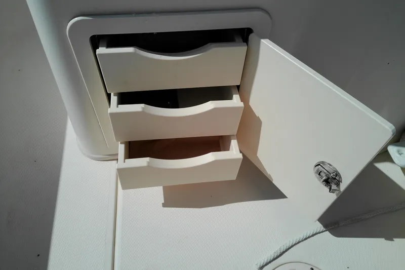 Slide: The Image of Storage drawers on a 2015 Grady-White 251 Coastal Explorer boat. - 26