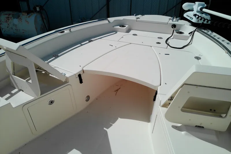 Slide: The Image of 2015 Grady-White 251 Coastal Explorer boat deck with storage compartments and seating. - 28