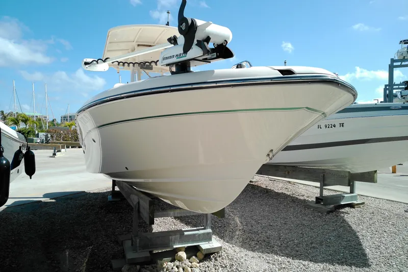 Slide: The Image of 2015 Grady-White 251 Coastal Explorer boat on display under clear blue sky. - 3