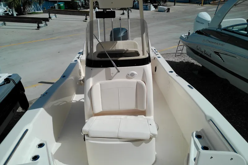 Slide: The Image of 2015 Grady-White 251 Coastal Explorer boat interior with seating and console. - 37