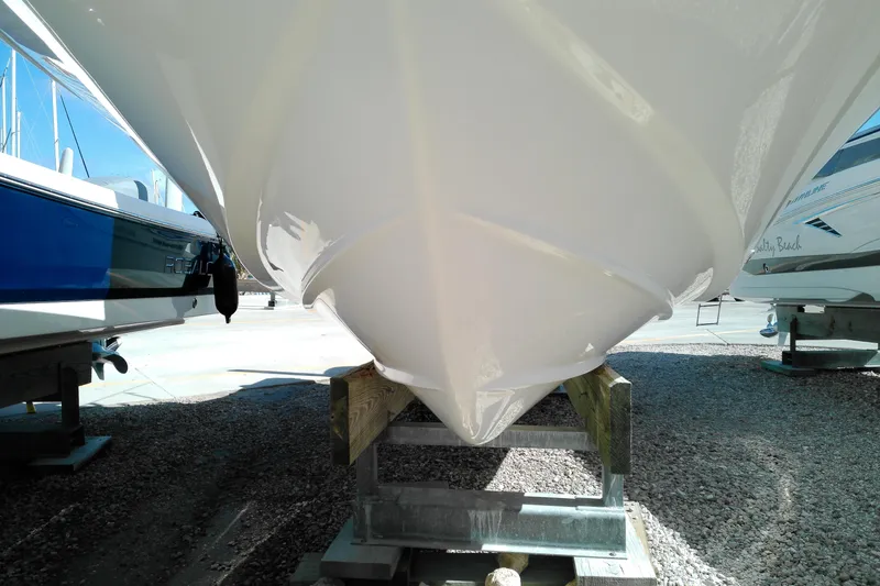 Slide: The Image of 2015 Grady-White 251 Coastal Explorer boat hull on display in a marina. - 4