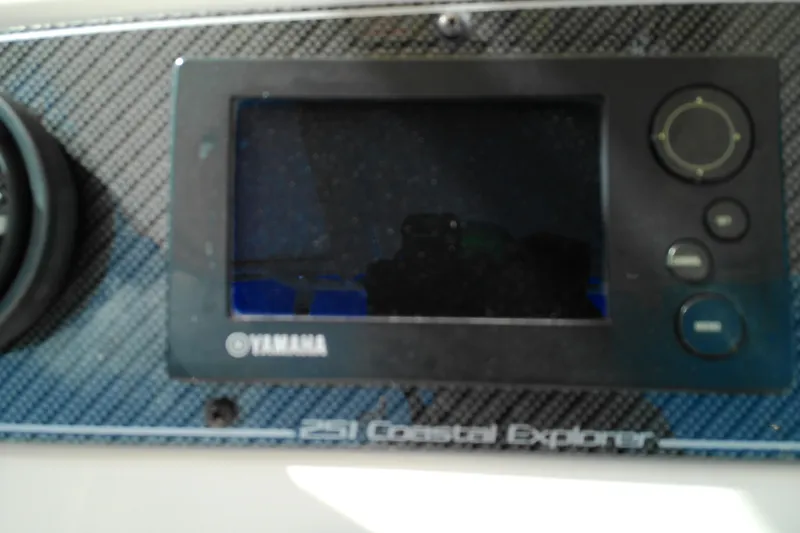 Slide: The Image of Control panel of a 2015 Grady-White 251 Coastal Explorer boat with Yamaha display. - 44