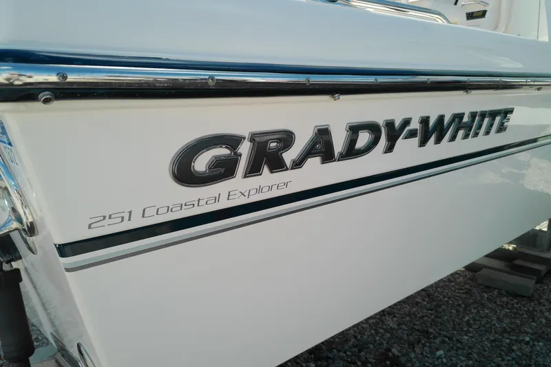 Slide: The Image of 2015 Grady-White 251 Coastal Explorer boat side view with logo. - 46