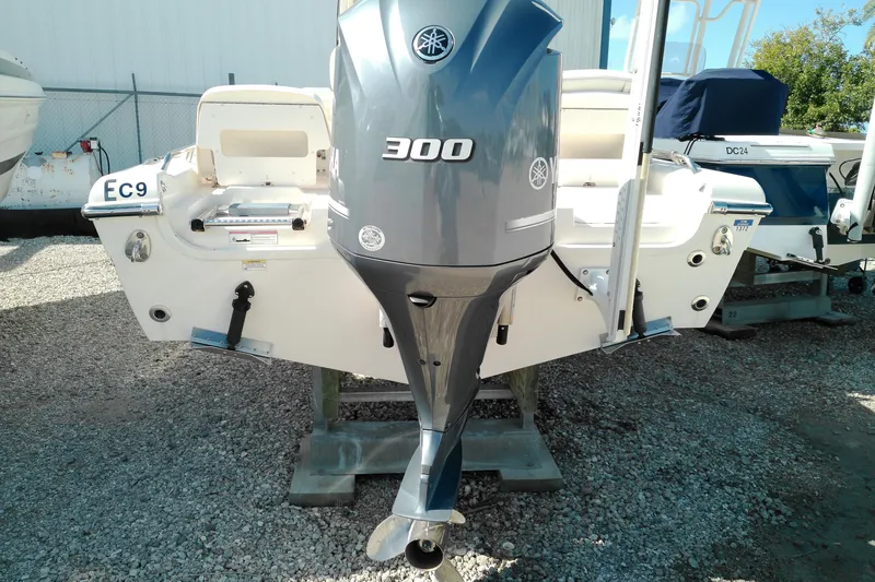 Slide: The Image of 2015 Grady-White 251 Coastal Explorer with Yamaha 300 outboard motor, displayed on gravel. - 6