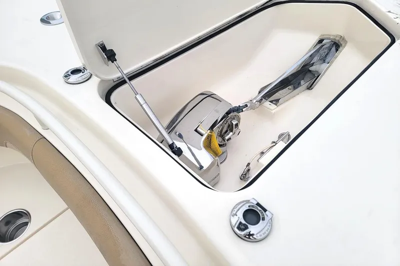 Slide: The Image of Anchor compartment of 2018 Scout 355 LXF boat, featuring stainless steel hardware. - 30