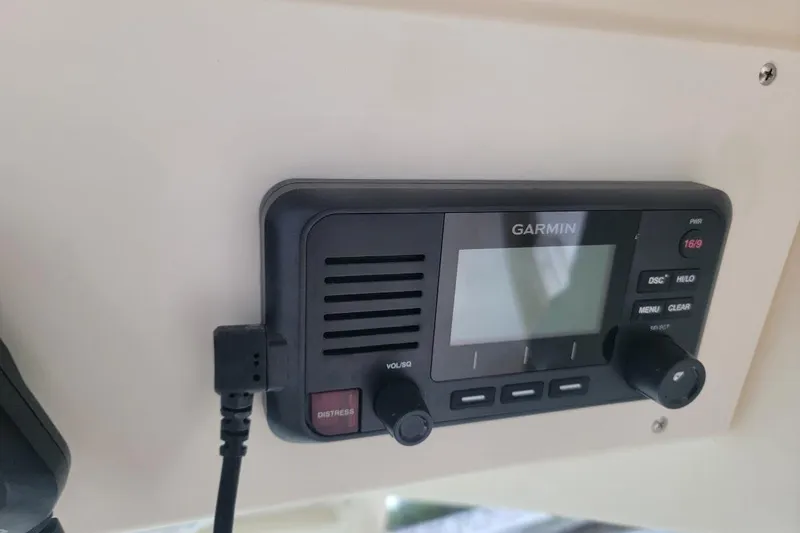 Slide: The Image of Garmin marine radio on 2018 Scout 355 LXF boat dashboard. - 39