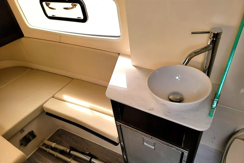 Slide: The Image of 2018 Scout 355 LXF cabin interior with seating and modern sink. - 40