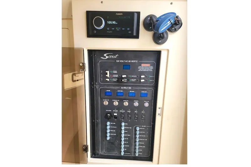 Slide: The Image of Control panel of a 2018 Scout 355 LXF boat with Fusion audio system. - 42