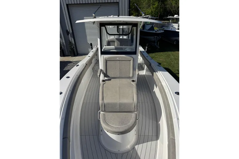 Slide: The Image of 2024 Sea Hunt Gamefish 28 Coffin Box boat, featuring spacious deck and seating. - 7