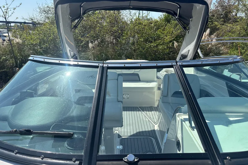 Slide: The Image of 2014 Monterey 328SS Super Sport boat interior with seating and windshield. - 14