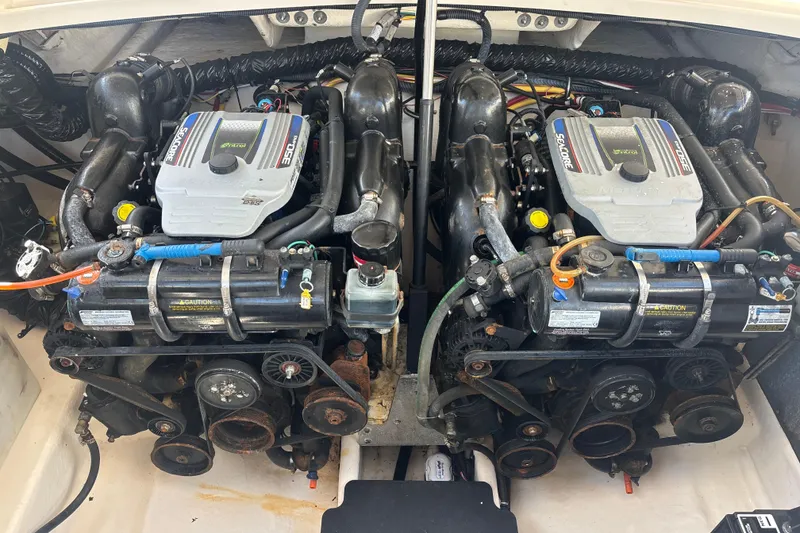 Slide: The Image of Twin engines in a 2014 Monterey 328SS Super Sport boat engine compartment. - 16