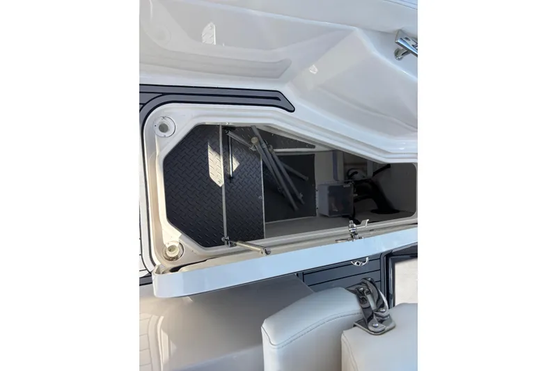 Slide: The Image of Open storage compartment on a 2014 Monterey 328SS Super Sport boat. - 19