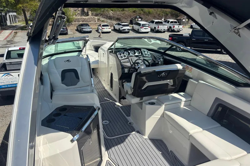 Slide: The Image of Interior of a 2014 Monterey 328SS Super Sport boat with luxurious seating and dashboard. - 5