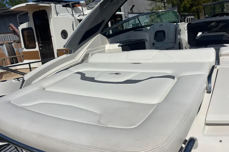 Slide: The Image of 2014 Monterey 328SS Super Sport boat with white leather seating and sleek design. - 7