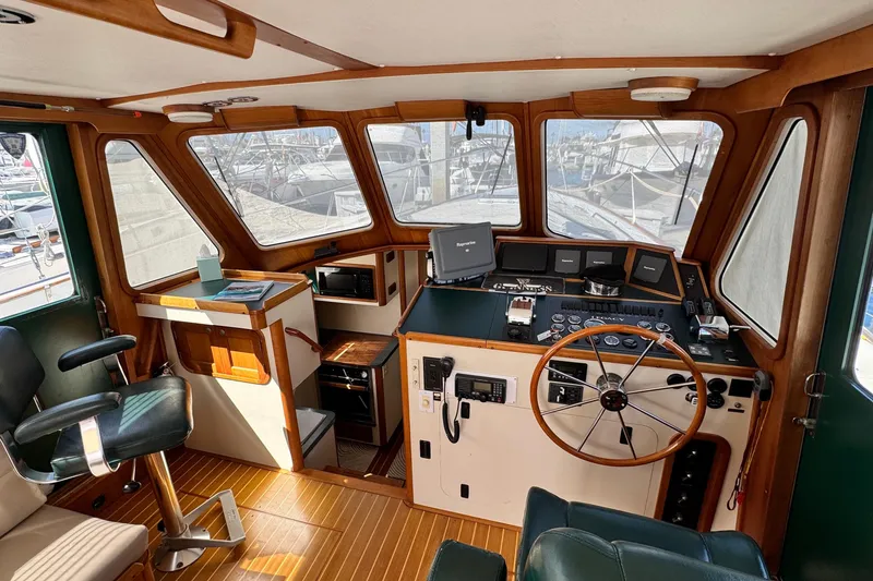 Slide: The Image of Interior of 1999 Legacy Yachts 40 Express, featuring helm and navigation equipment. - 11