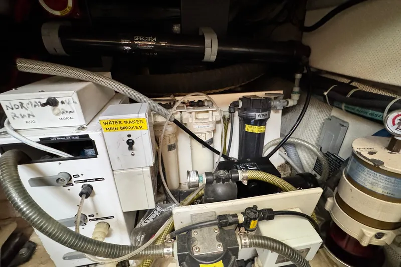 Slide: The Image of Engine room of 1999 Legacy Yachts 40 Express with water maker system components. - 21