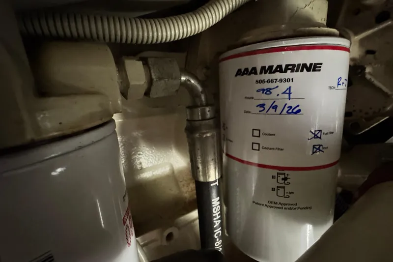 Slide: The Image of Engine compartment of 1999 Legacy Yachts 40 Express with AAA Marine fuel filter. - 22
