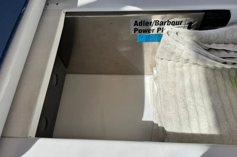 Slide: The Image of Storage compartment on a 1999 Legacy Yachts 40 Express with Adler/Barbour Power Plate. - 25