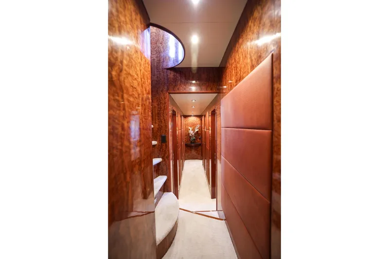 Slide: The Image of Luxurious interior hallway of 1996 Monte Fino Eurostyle yacht with polished wood finish. - 11