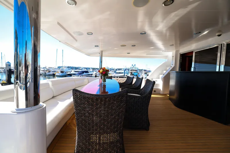 Slide: The Image of Luxurious 1996 Monte Fino Eurostyle yacht deck with elegant seating and marina view. - 15