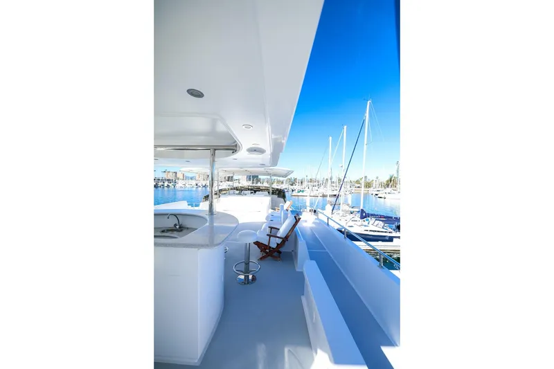 Slide: The Image of Luxurious 1996 Monte Fino Eurostyle yacht deck with marina view and seating area. - 5