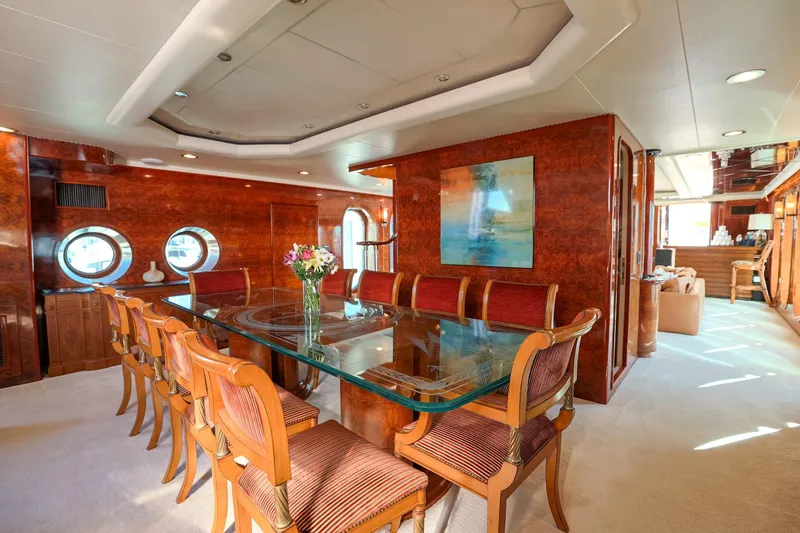 Slide: The Image of Luxurious dining area on a 1996 Monte Fino Eurostyle yacht with elegant wood finishes. - 9