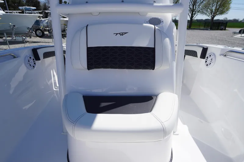 Slide: The Image of 2025 Tidewater 210 LXF boat interior with cushioned seating and sleek design. - 12