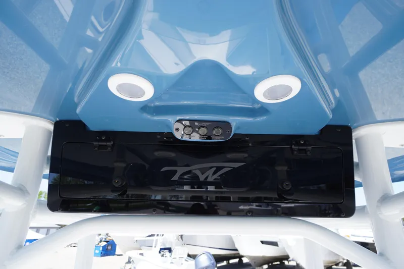 Slide: The Image of 2025 Tidewater 210 LXF boat with blue hull and integrated speakers. - 16