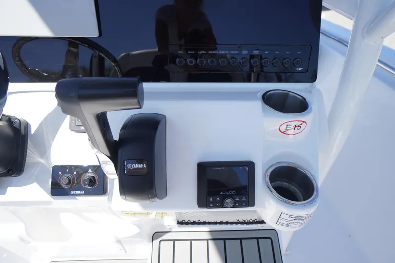 Slide: The Image of Control panel of 2025 Tidewater 210 LXF boat featuring Yamaha controls and JL Audio system. - 26