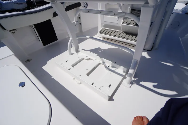Slide: The Image of 2025 Tidewater 210 LXF boat interior with seating and storage features. - 34