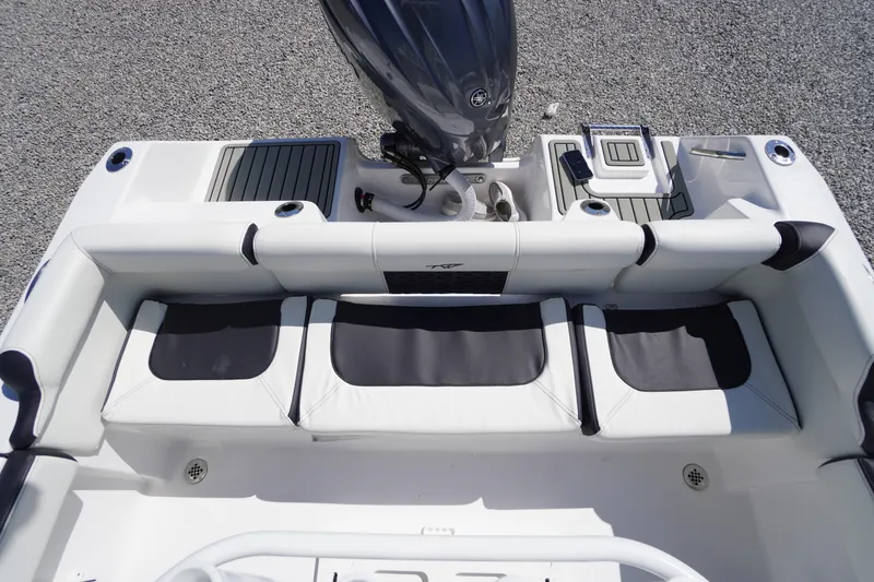 Slide: The Image of 2025 Tidewater 210 LXF boat interior with cushioned seating and modern design. - 36