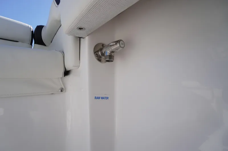 Slide: The Image of 2025 Tidewater 210 LXF boat raw water outlet detail. - 40