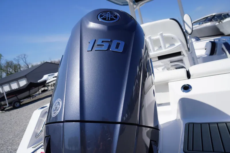 Slide: The Image of 2025 Tidewater 210 LXF boat with a 150 horsepower engine, displayed outdoors. - 43