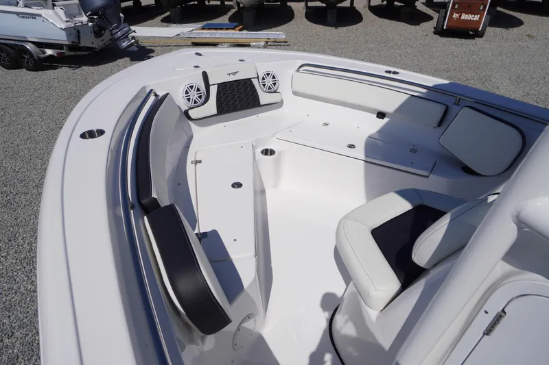 Slide: The Image of 2025 Tidewater 210 LXF boat interior with seating and speakers, showcasing modern design. - 8
