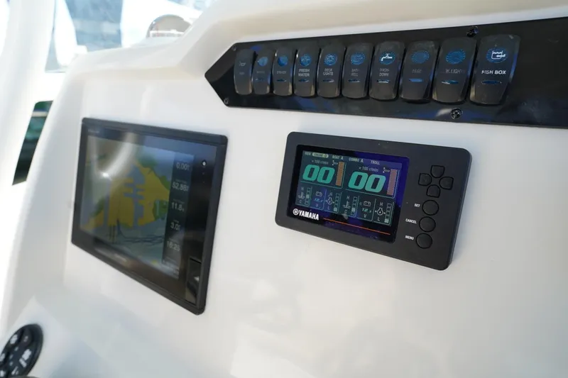 Slide: The Image of Dashboard of 2018 Sailfish 290 CC boat with Yamaha display and control panel. - 6