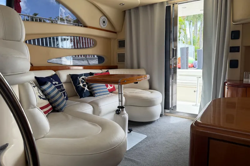 Slide: The Image of Luxurious interior of a 2004 Azimut 39E yacht with plush seating and nautical decor. - 11