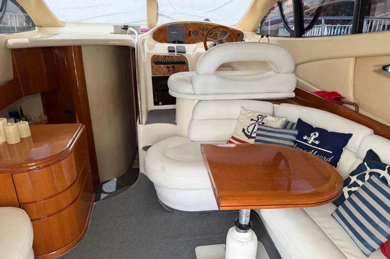 Slide: The Image of Luxurious interior of a 2004 Azimut 39E yacht with elegant seating and nautical decor. - 18