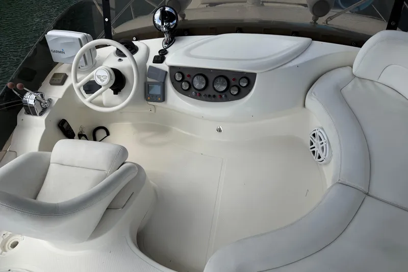 Slide: The Image of Cockpit of 2004 Azimut 39E yacht with steering wheel, controls, and seating. - 7