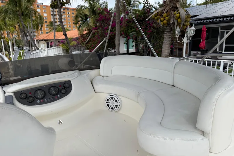 Slide: The Image of Luxurious 2004 Azimut 39E yacht interior with white seating and control panel. - 8
