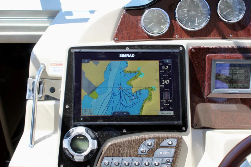 Slide: The Image of Simrad navigation system on 2011 Sea Ray Sundancer 350 boat dashboard. - 15