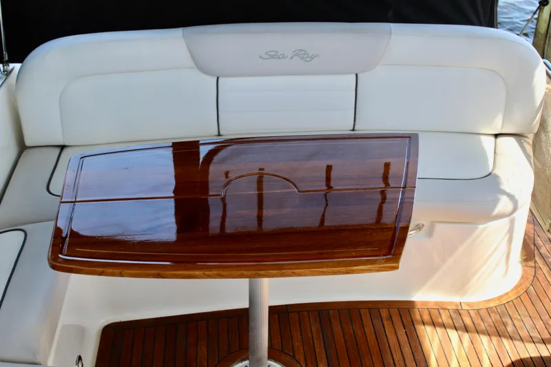 Slide: The Image of Luxurious seating and polished table on 2011 Sea Ray Sundancer 350 yacht. - 20
