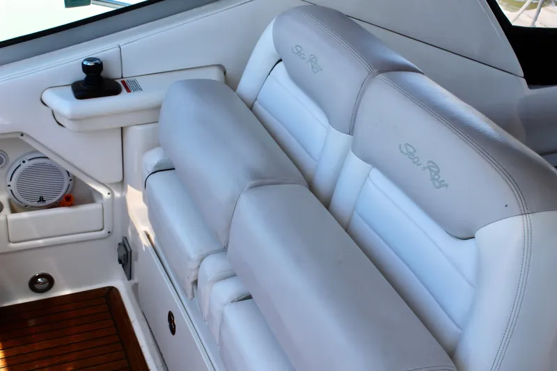Slide: The Image of Interior seating of 2011 Sea Ray Sundancer 350 yacht with white upholstery and wood flooring. - 21