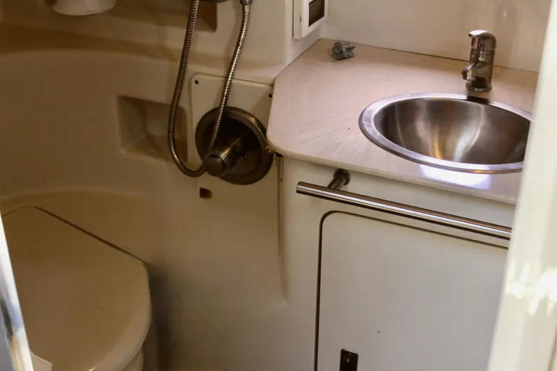 Slide: The Image of Compact bathroom in 2011 Sea Ray Sundancer 350 yacht with sink and toilet. - 31