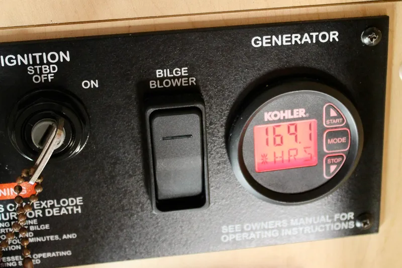 Slide: The Image of Control panel of a 2011 Sea Ray Sundancer 350 with Kohler generator display. - 34
